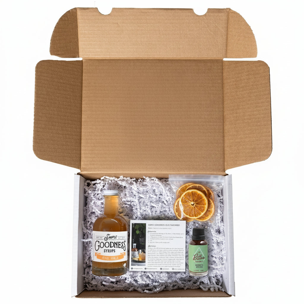 Open old fashioned cocktail kit with a bottle labeled Orange Vanilla  with bitters and orange slices